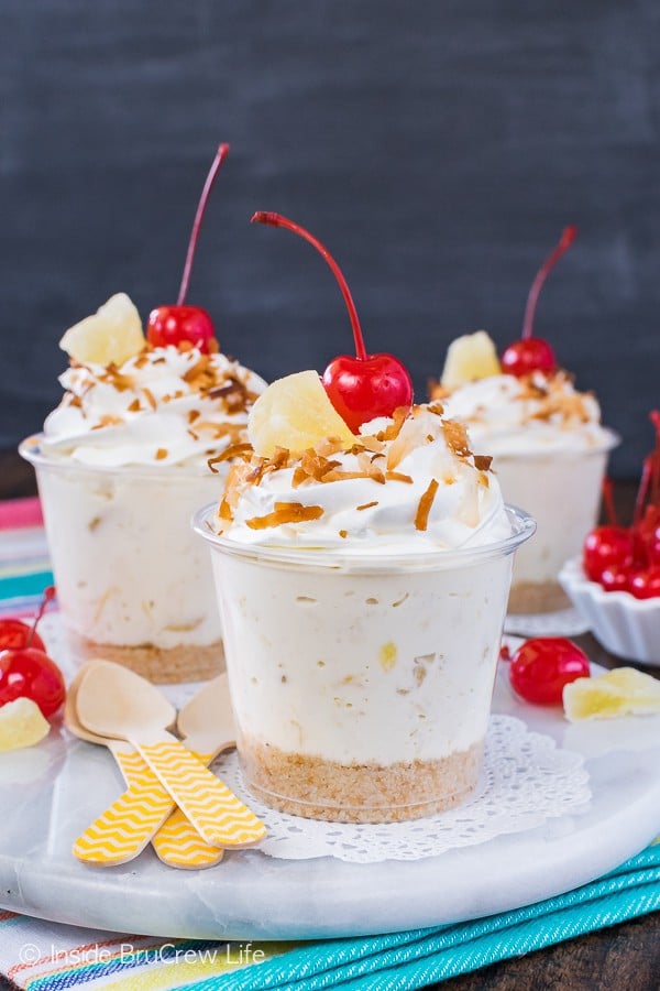 No Bake Pina Colada Cheesecake Parfaits - adding coconut and pineapple to a creamy cheesecake makes a fun and easy dessert. Great recipe for summer parties and picnics!