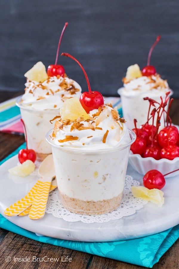 No Bake Pina Colada Cheesecake Parfaits - an easy cheesecake filling full of coconut and pineapple. Great recipe for picnics!