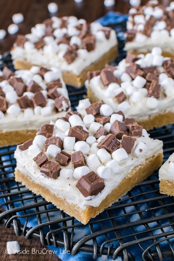 S'mores Sugar Cookie Bars - a sweet graham cracker flavored cookie topped with chocolate and marshmallow is the perfect recipe for summer picnics!