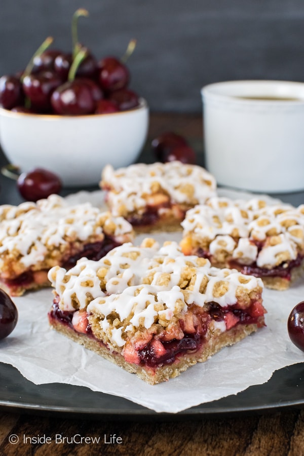 Cherry Apple Crumble Bars - a drizzle of glaze holds these crumbly fruit bars together. Great recipe for summer picnics!