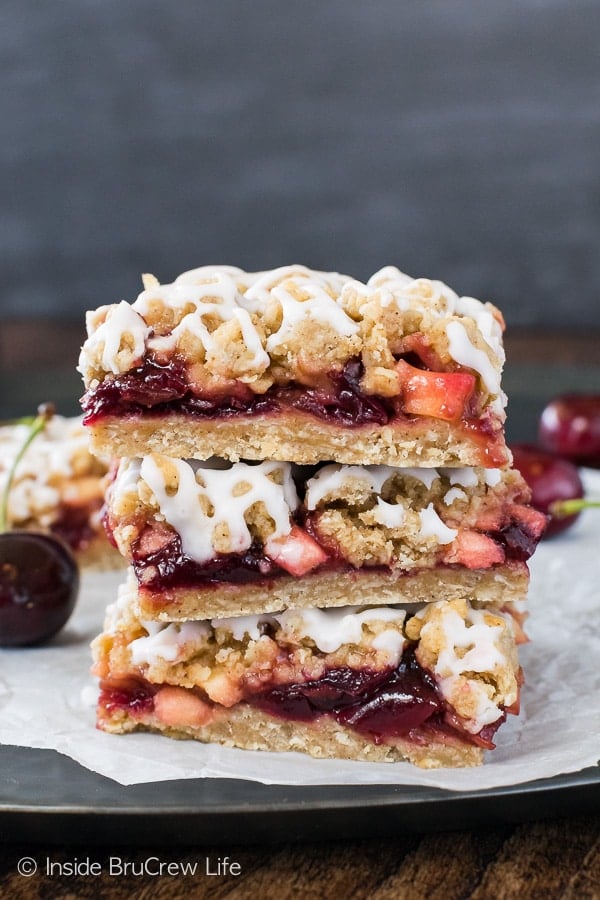 Cherry Apple Crumble Bars - sweet cherry preserves and apple chunks add a great flavor to this easy crumble bar! Great recipe for summer picnics!