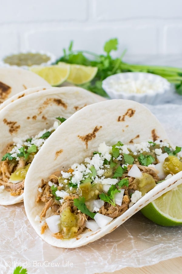 Green Chile Pulled Pork Tacos - crock pot pork, cheese, and salsa are all you need for this easy taco dinner. Great recipe for busy days and nights!