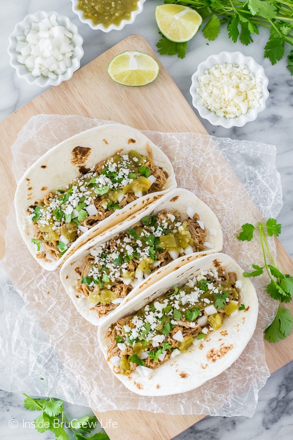 Green Chile Pulled Pork Tacos - make a batch of easy slow cooker pulled pork for this taco dinner. Great recipe for busy days!