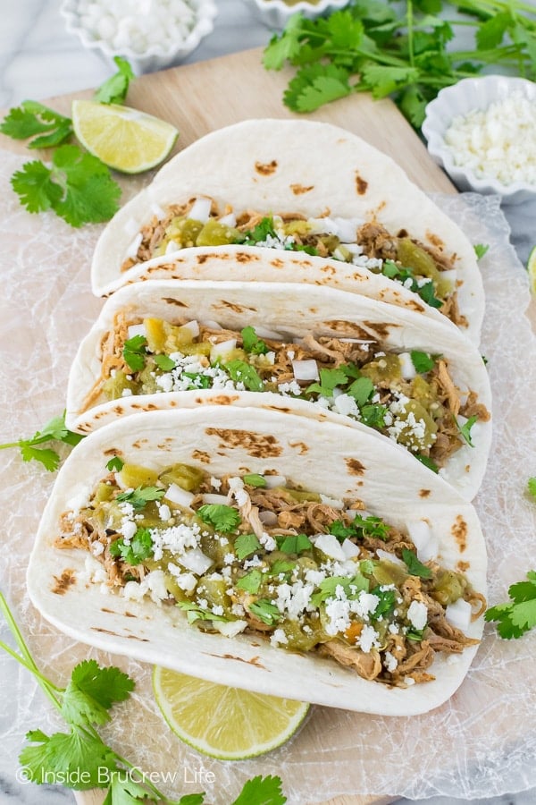 Green Chile Pulled Pork Tacos - fill your tortillas with as much meat, cheese, and veggies as you like. Easy recipe to have on the table in under 30 minutes!
