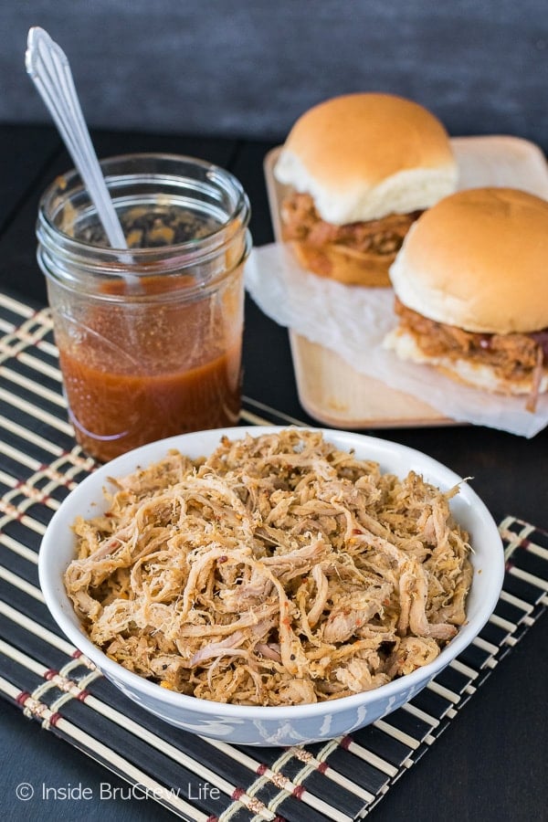Easy Slow Cooker Pulled Pork - add some seasonings and a pork tenderloin to your crock pot for an easy summer meal! Delicious recipe for picnics and parties!