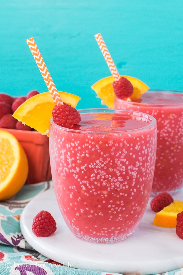 Raspberry Orange Slushies - fresh fruit, juice, and ice is all you need to make these easy slushies! Great summer drink recipe!