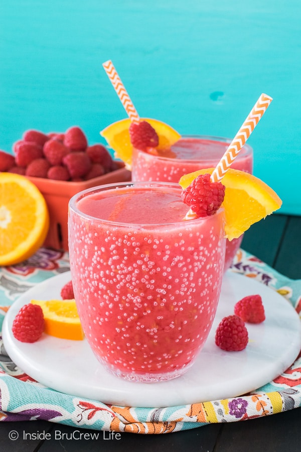 Raspberry Orange Slushies - blending ice, fruit, and juice creates a delicious iced drink. Great recipe for hot summer days!