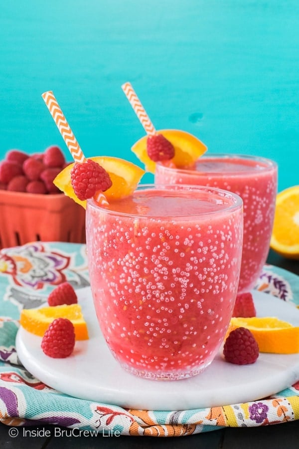 Raspberry Orange Slushies - fresh fruit, juice, and ice mixed together makes a refreshing drink. Perfect recipe for a hot summer day!