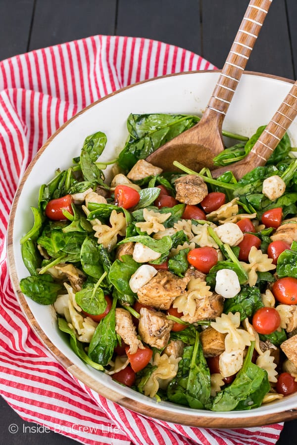 Spinach Chicken Caprese Salad - greens, chicken, cheese, and a homemade dressing is a delicious meal. Great recipe for busy nights!