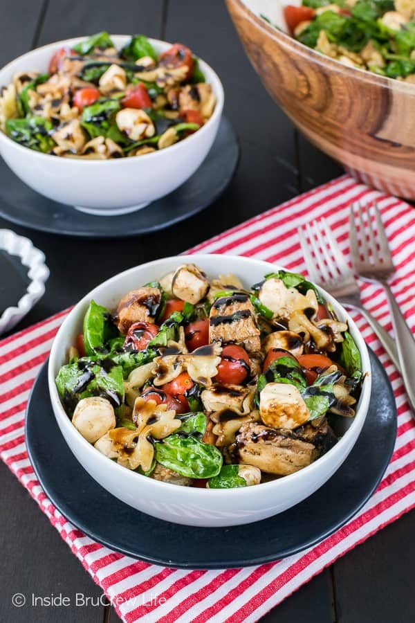 Spinach Chicken Caprese Salad - a big bowl of veggies and meat drizzled with a homemade dressing is the perfect light meal. Great recipe for busy days!