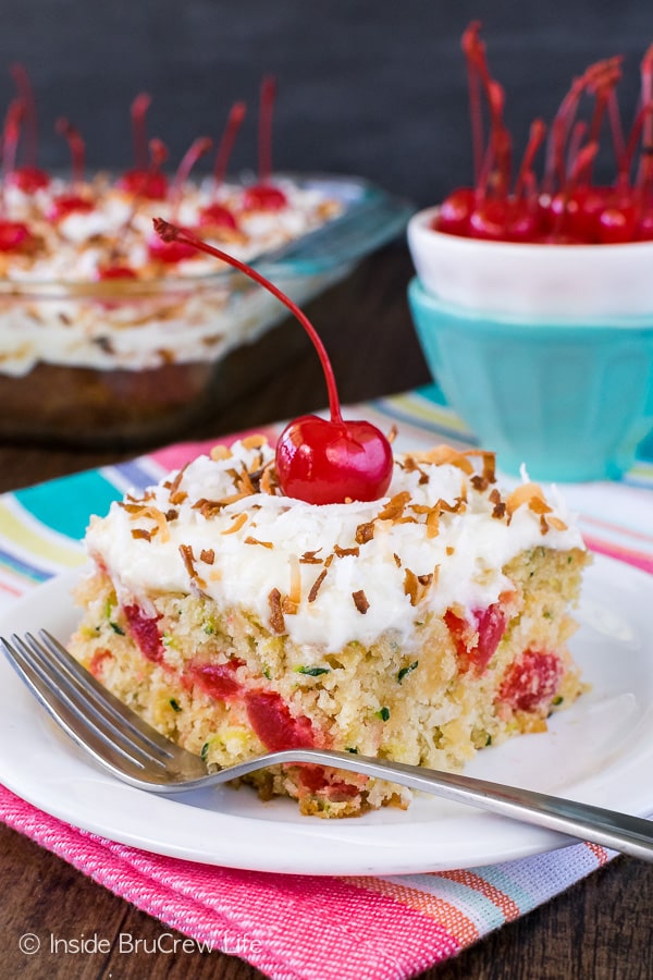 Pina Colada Zucchini Cake - this fluffy cake is loaded with pineapple and coconut and is topped with a delicious creamy frosting. Great summer dessert recipe!