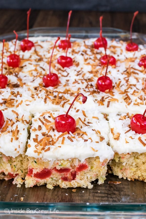 Pina Colada Zucchini Cake - this easy cake is loaded with pineapple, coconut, cherries, and zucchini. This delicious tropical recipe is the perfect summer dessert!