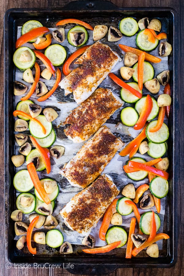 Overhead picture of a sheet pan with chili lime cod and roasted veggies