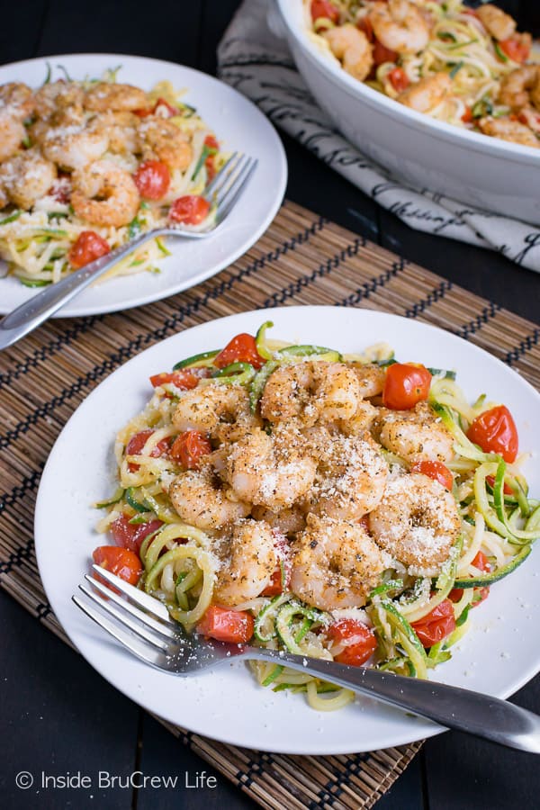 Parmesan garlic shrimp and zucchini noodles on two white plates
