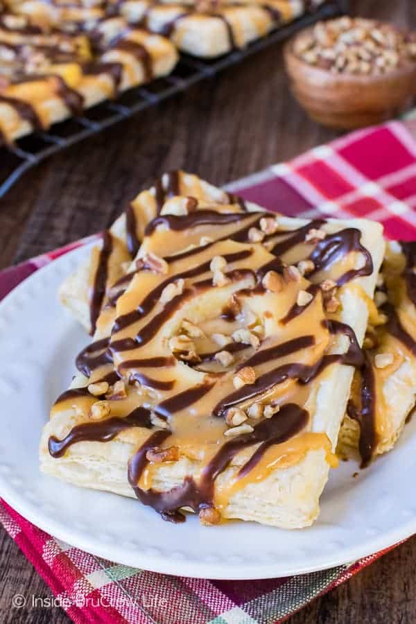 Caramel Apple Cheesecake Tarts - this easy pastry has cheesecake and apples drizzled in caramel and chocolate. Best fall breakfast or dessert recipe!!