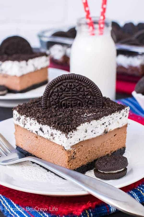 Chocolate Cookies and Cream Cheesecake Bars - four layers of chocolate and cookie goodness in every single bite. Great cheesecake recipe that everyone will love!