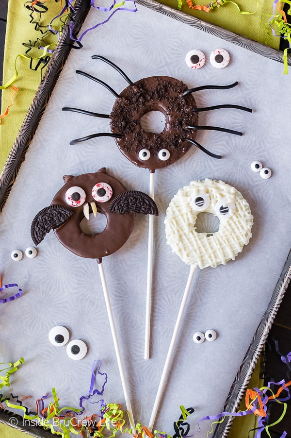 Chocolate Dipped Halloween Apple Rings - apple rings dipped in chocolate get a fun Halloween flair from cookies and candy eyes! Easy no bake treat for Halloween!