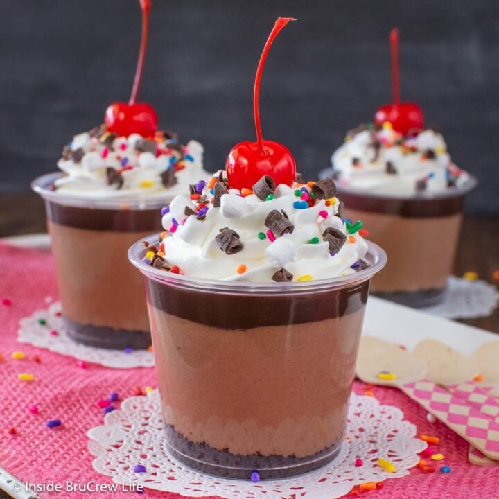 Three mini cups filled with chocolate layers.