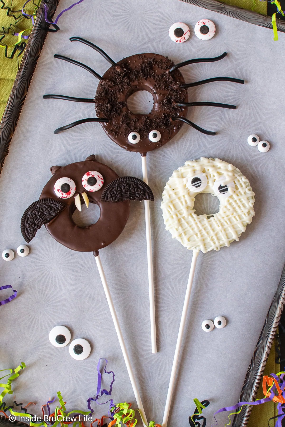 Monster decorated apple slices on a tray.