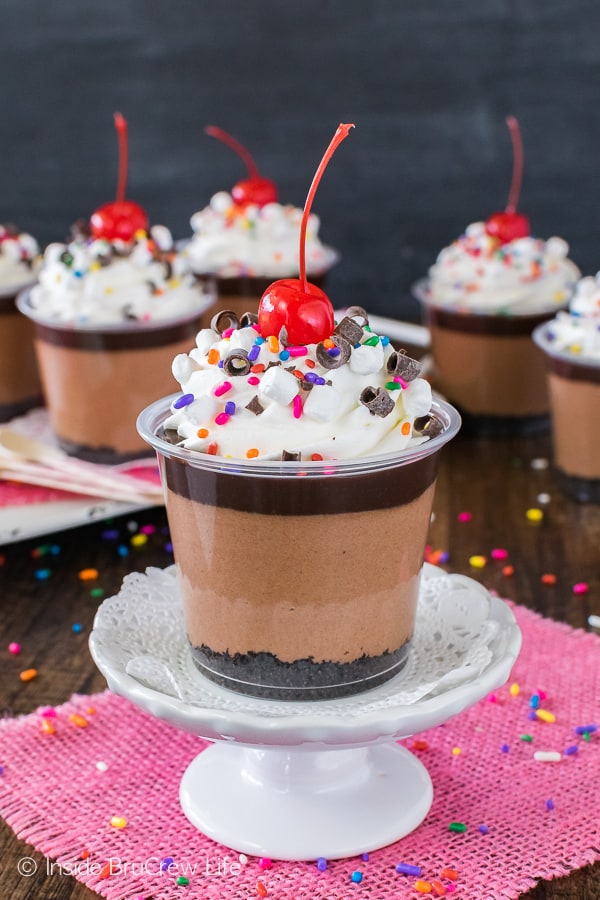 No Bake Triple Chocolate Cheesecake Parfaits - easy no bake recipe made with three layers of chocolate, sprinkles, and a cherry! Perfect for any party or celebration!