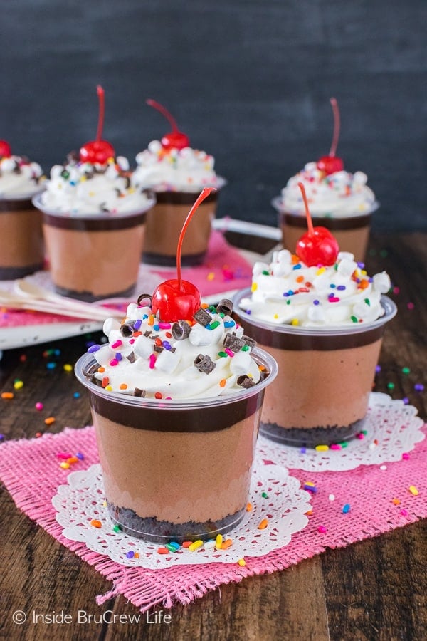 No Bake Triple Chocolate Cheesecake Parfaits - cherries, sprinkles, and three layers of chocolate makes this no bake recipe perfect for any party!