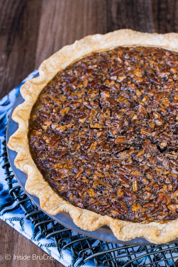 Chocolate Fudge Pecan Pie - toasted pecans and hot fudge make this gooey pie an amazing dessert. Easy recipe to make ahead of time for Thanksgiving dinner!