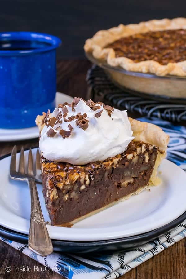 Chocolate Fudge Pecan Pie - a gooey fudge layer and toasted pecans make this pie an amazing addition to Thanksgiving dinner. Easy recipe to make ahead of time!