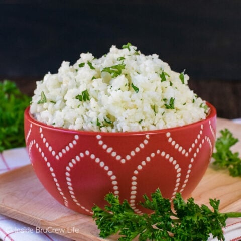 A red bowl filled with easy cauliflower rice.