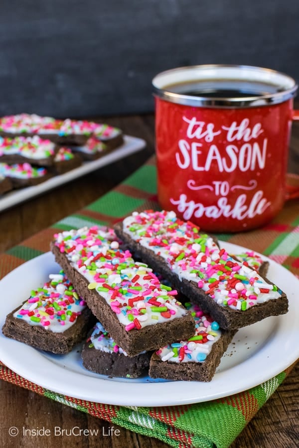 Frosted Mocha Shortbread Cookie Sticks - easy chocolate cookies topped with white chocolate and lots of sprinkles. Great recipe for holiday cookie exchanges!