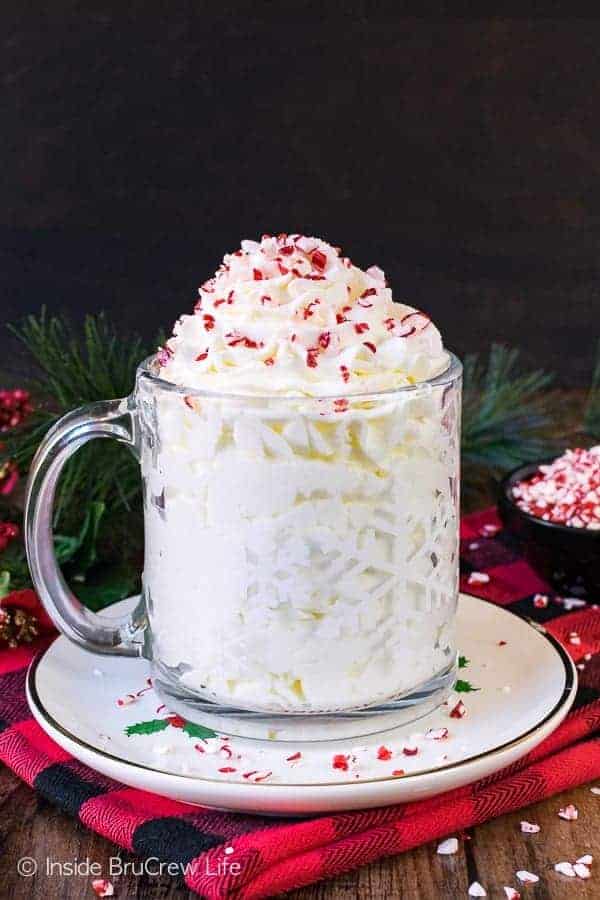 Peppermint Whipped Cream - this easy and creamy topping is perfect for adding to most Christmas desserts. Great recipe for holiday parties!