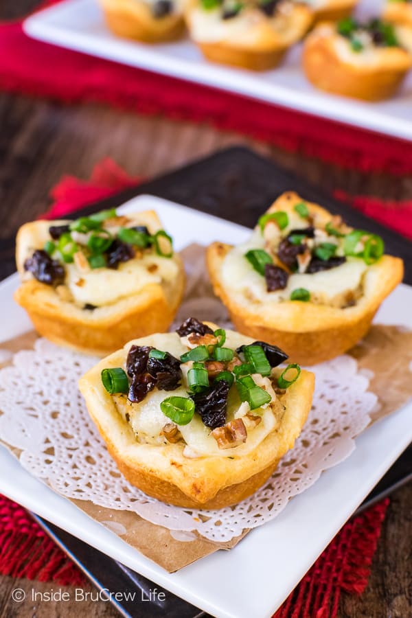 3 crescent roll cups with chicken salad in them. 