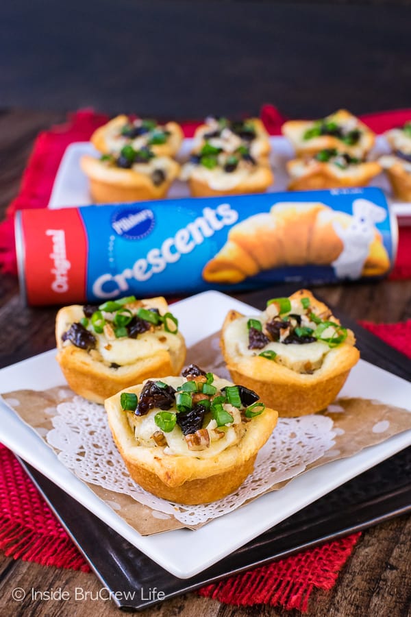 3 bite sized appetizers with a package of crescent rolls in the background.