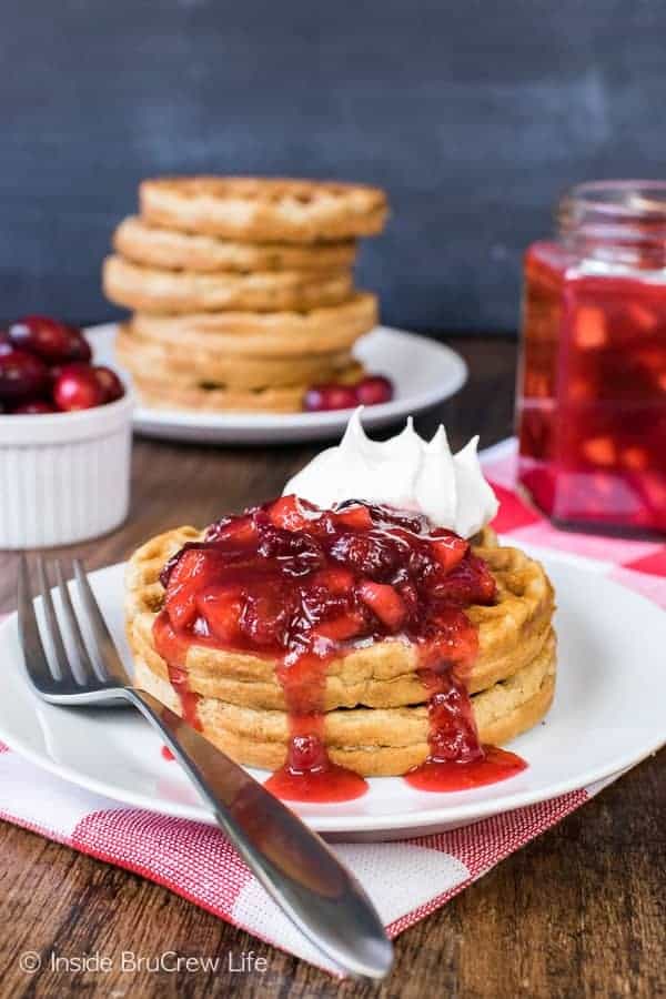 Spiced Apple Waffles - these easy homemade waffles are loaded with apple flavor. Add a spoonful of apple cranberry sauce for even more apple goodness. Easy breakfast recipe to make ahead of time!