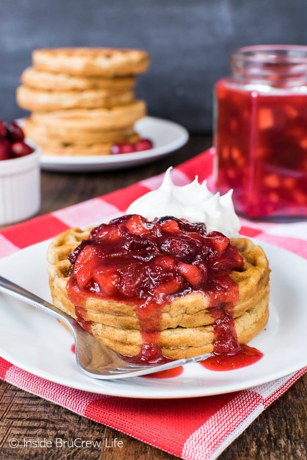 Spiced Apple Waffles - homemade apple waffles with a delicious maple apple cranberry sauce is an easy recipe to make ahead of time for holiday breakfasts!