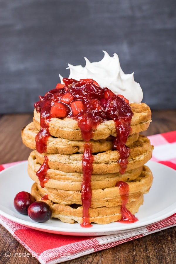 Spiced Apple Waffles - homemade waffles loaded with shredded apples and topped with apple cranberry sauce. Easy recipe to make ahead of time for the holidays!