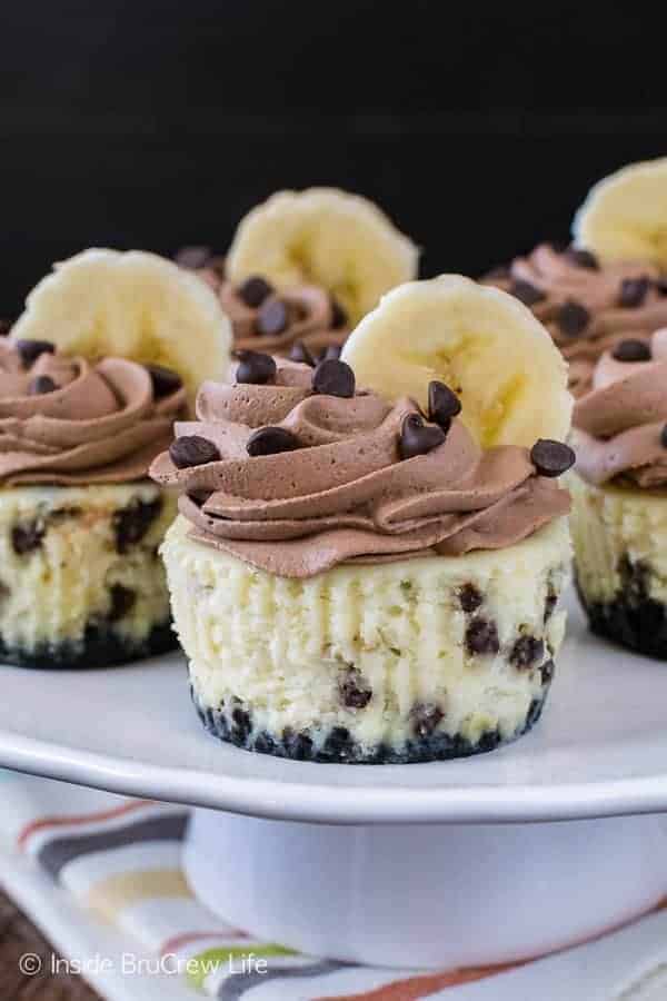 Banana Chocolate Chip Cheesecakes - little cheesecake cupcakes are loaded with real banana flavor and chocolate chips. Homemade chocolate whipped cream on top of this recipe adds a fun flair! 