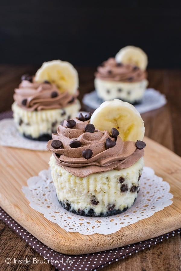 Banana Chocolate Chip Cheesecakes - mini banana cheesecakes loaded with chocolate chips and topped with homemade chocolate whipped cream. Make this easy recipe for parties or bake sales!