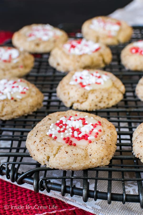 Eggnog Thumbprint cookies on a black wire rack.