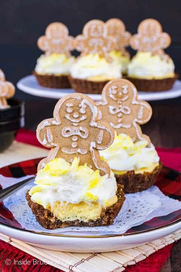 Gingerbread man cookie sitting on Lemon Gingersnap Cheesecake Tart.