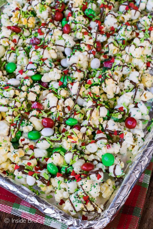 Mint Grinch Popcorn spread out on a cookie sheet.