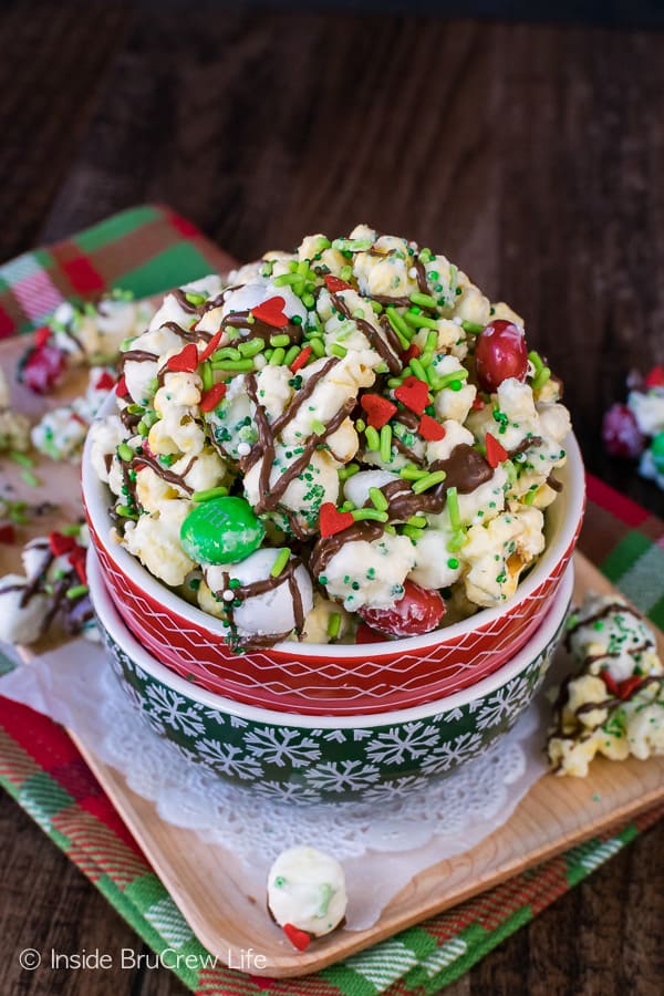 Mint Grinch Popcorn in a Christmas bowl.