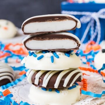 Four homemade peppermint patties stacked on top of each other.