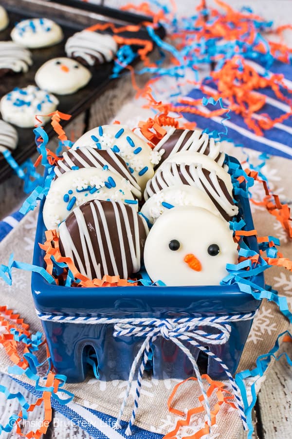 A blue box filled with homemade peppermint patties topped with sprinkles.