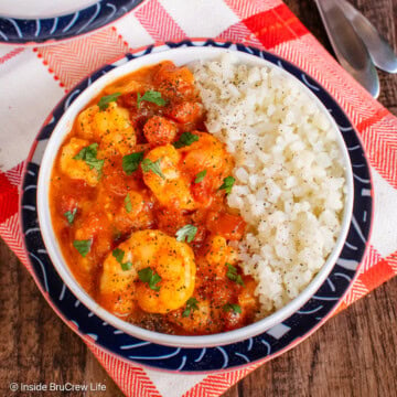 An overhead picture of coconut shrimp curry in bowls.