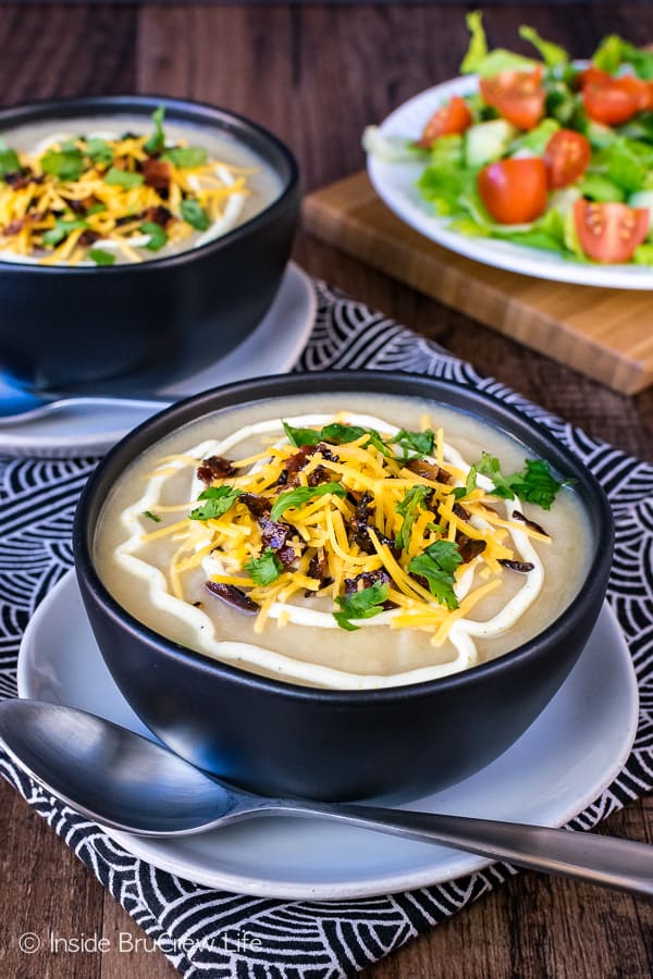 Loaded Cauliflower Soup - the base of this creamy soup is made from cauliflower. Add cheese and bacon to top it off. Easy healthy recipe that tastes like comfort food!