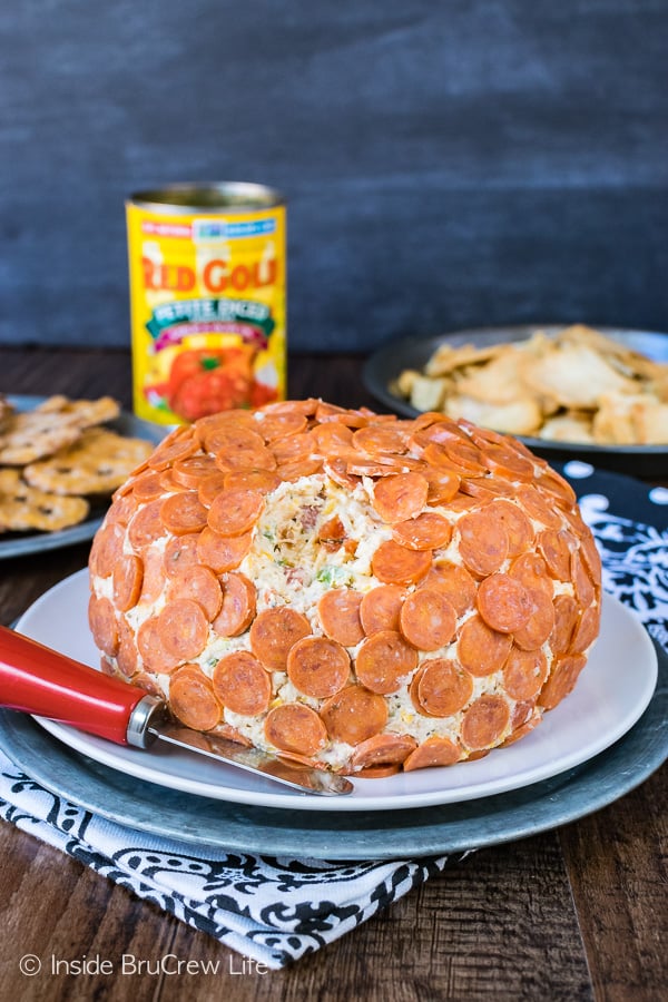 A cheese ball with mini pepperonis on it.