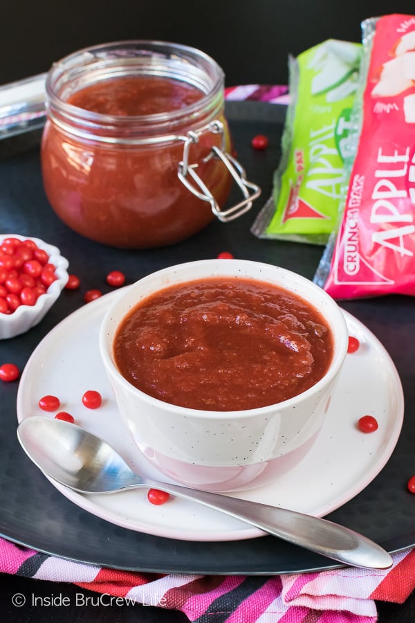 Crock Pot Cinnamon Strawberry Applesauce - this easy applesauce is made with just three ingredients in a crock pot. Great recipe to use up extra apples! #apple #cinnamon #redhots #crockpot #recipe #applesauce #strawberry #homemade #easy