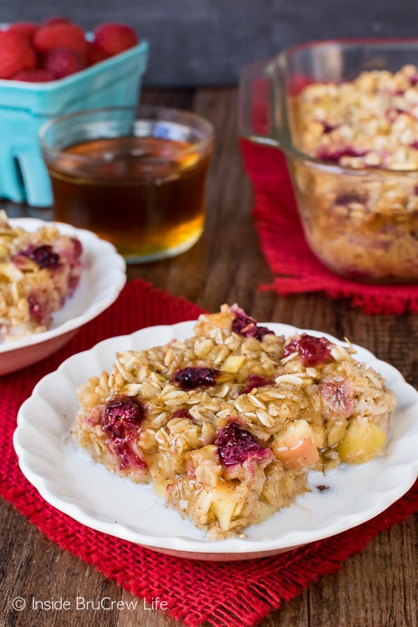 Raspberry Apple Baked Oatmeal - a pan of baked oatmeal made with apples and frozen fruit is a delicious way to start the day. Easy recipe for busy mornings. #oatmeal #apple #raspberry #bakedoatmeal #easy #recipe #breakfast 
