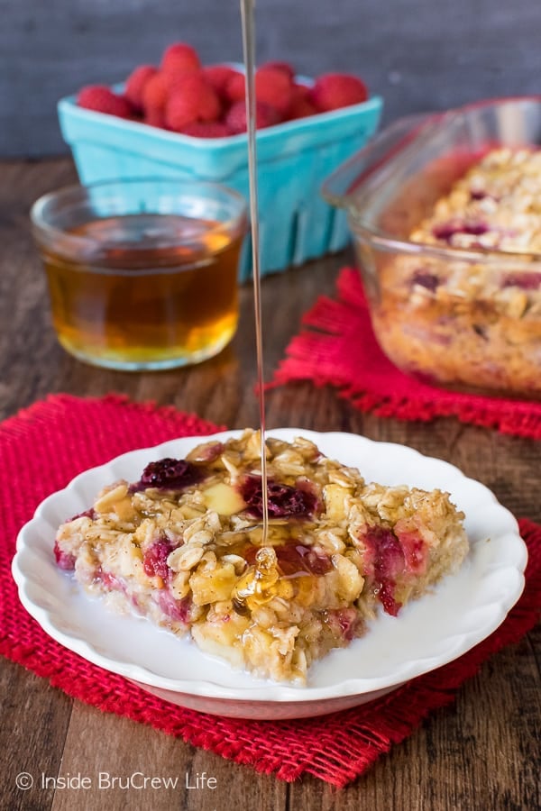Raspberry Apple Baked Oatmeal - baked oatmeal with apples and frozen fruit is a great way to start out the day. Easy recipe to make ahead of time for busy mornings! #oatmeal #apple #raspberry #bakedoatmeal #easy #recipe #breakfast 