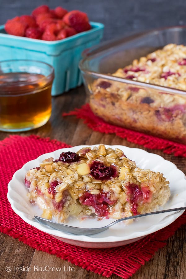 Raspberry Apple Baked Oatmeal - make a pan of baked oatmeal loaded with apples and frozen fruit to have on hand for busy mornings. Easy recipe to make ahead of time! #oatmeal #apple #raspberry #bakedoatmeal #easy #recipe #breakfast 